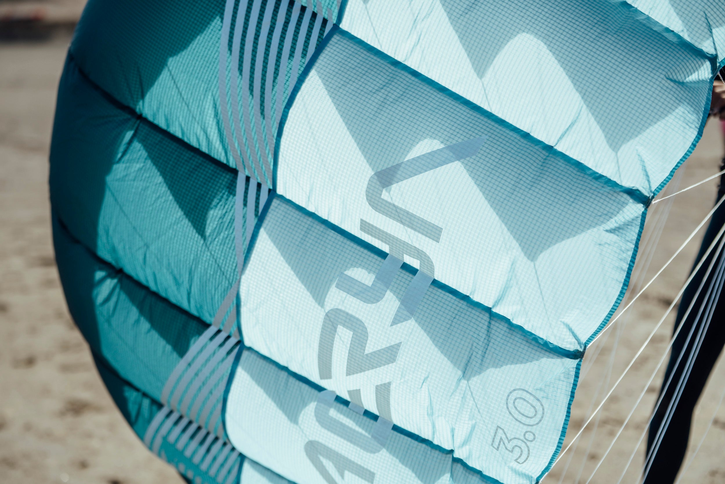 a close up picture of the material used in a parawing or pocket wing with a Aeryn logo n the kite the size appera to be 3.0